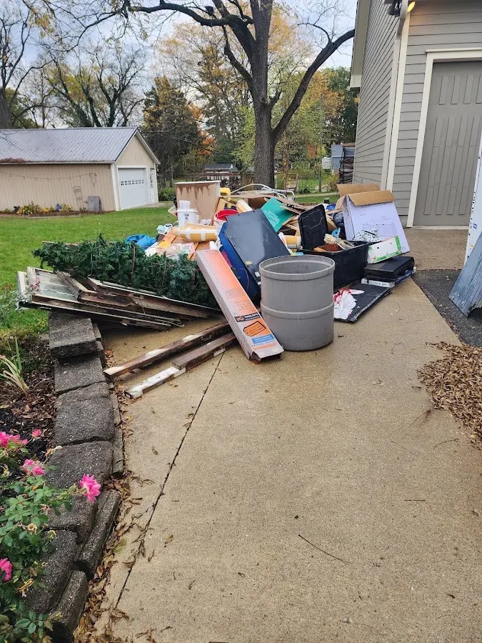 Dumpster being loaded with debris for Commercial Dumpster Rental in Mooers